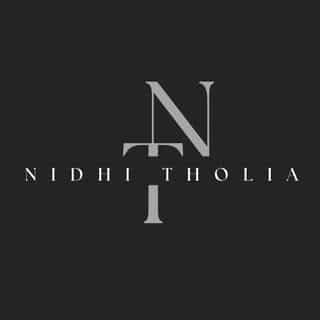 NidhiTholia logo