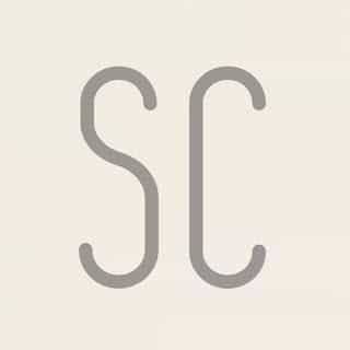 Sand + Charcoal logo