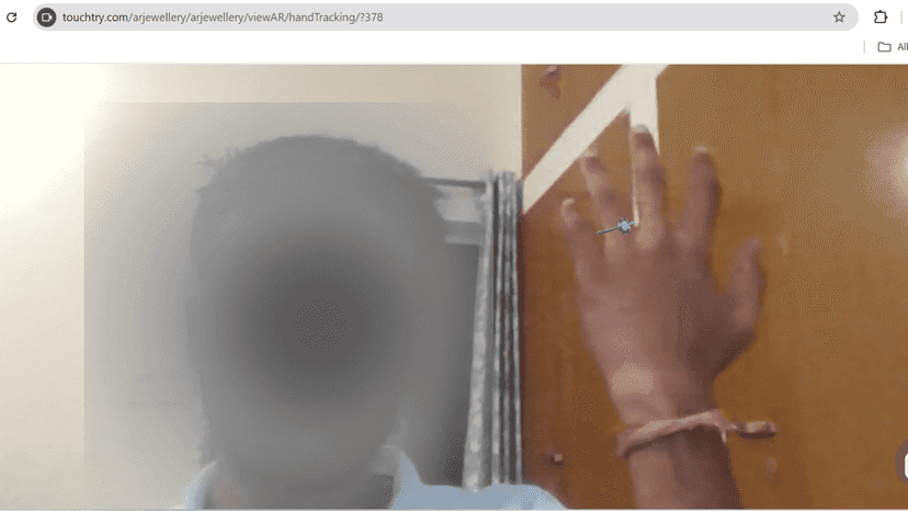 Shopper trying ring on hand in live mobile AR view